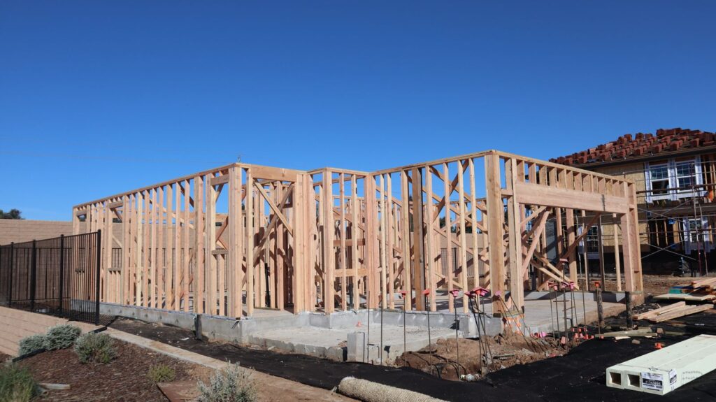 Wood framing stage of a custom home under construction in a Westchester NY subdivision