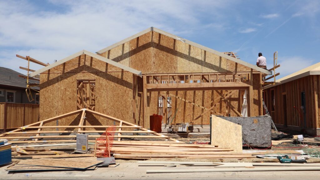 Framing stage of a home addition under construction